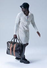 Black men wearing white atleisure clothing with a large bag | Save The Duck