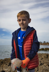 Young Boy wearing a red vest | Save The Duck