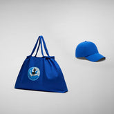 A blue tote bag with the SaveTheDuck logo and a matching blue baseball cap, displayed in a studio setting. | Save The Duck | Animal Free Elegant Duvets for Men and Women