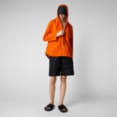 Veste de pluie Dawa pour femme en orange ambre | Sauvez le canard