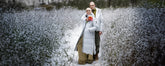 A female and male model wearing white parkas in a field of snow. - Women's Arctic | Save The Duck