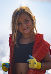 Young Girl wearing a red vest | Sauvez le canard