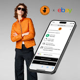Stylish model wearing an orange SaveTheDuck recycled jacket, paired with a smartphone displaying eBay and Certilogo interface for eco-friendly fashion reselling. | Save The Duck